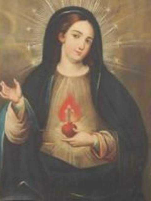La imagen representa a la Virgen María con el Sagrado Corazón, rodeada de una luz radiante.
