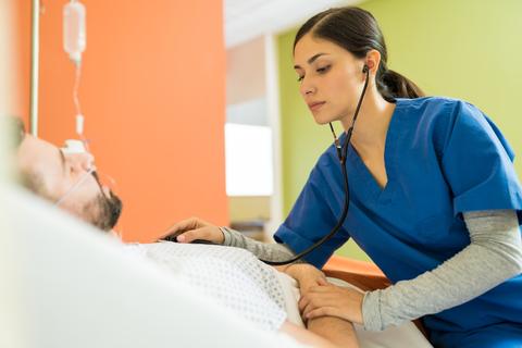 hispanic-female-doctor-examining-patient-with-stethoscope-hospital.jpeg