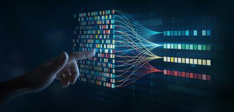 Un dedo apunta a una visualización de datos digital llena de colores y conexiones.